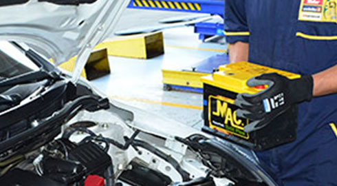 Man Carrying Battery to Car