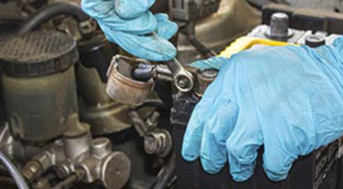 Removing Car Battery with Wrench